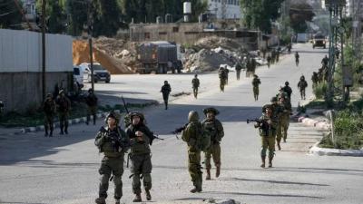 Israeli Forces Raid Camps in the West Bank and Arrest Dozens