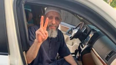 Libyan Group Leader Throws Money in the Street Celebrating His Release from Prison