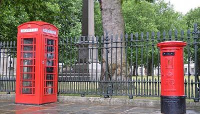 Title: Britain Unveils First Red Post Box with King Charles' Emblem