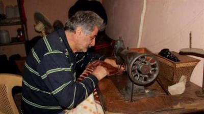 Title: "Ironing with Charcoal and the Old Sewing Machine"