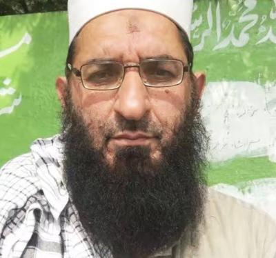 Who is "Ameen al-Haq," close to Bin Laden?