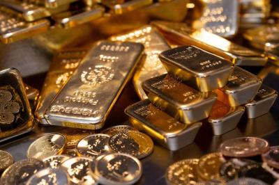 Gold Retreats After Record Peak