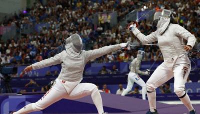 Title: Pregnant Fencer Participates in Olympics!