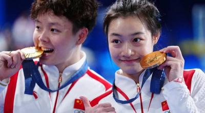 Why Do Athletes "Bite" Their Medals?