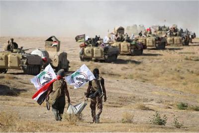 ما العوامل التي أدت إلى المطالبة بدمج الحشد الشعبي بالجيش العراقي؟