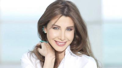 نانسي عجرم تُثير الجدل بتصرف مفاجئ في عزاء زوج كارول سماحة!