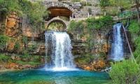 A horizon spring and its waterfalls Springs of Afqa and its waterfalls
