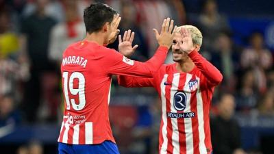 أتلتيكو مدريد يهزم إشبيلية بعشرة لاعبين